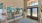 a room with glass doors and a rug