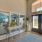 a room with glass doors and a rug