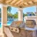 a large outdoor kitchen with a large outdoor grill