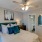 a bedroom with a bed and a fan