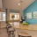 a kitchen with a bar and chairs