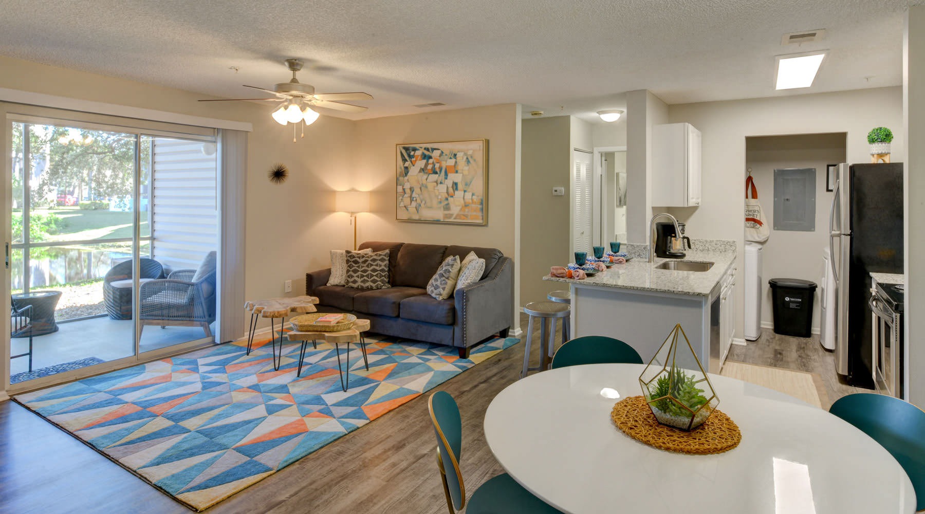 Beautiful living areas to match your lifestyle a living room with a table and chairs