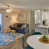 a living room with a table and chairs