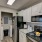 a kitchen with white cabinets