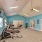 a room with exercise equipment and screens